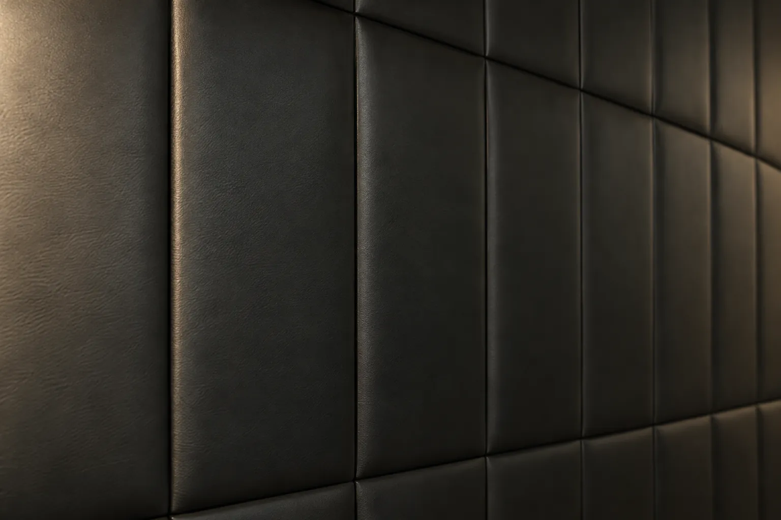 Black padded faux leather wall panels in a clean grid